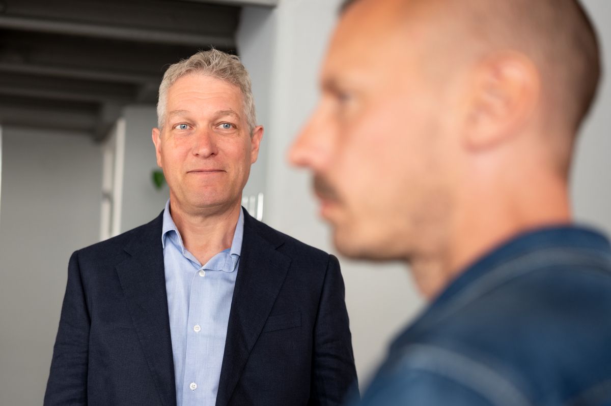 A customer in a suit listening critically